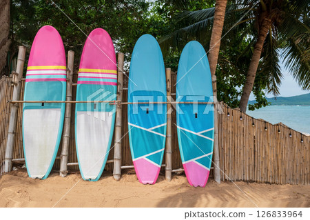 surfboard of resort by bamboo wall and coconut tree, Pattaya surfboard of resort by bamboo wall and coconut tree, Pattaya 126833964