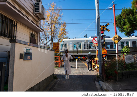 People wait JR Train pass road junction to Tofukuji station, Kyoto 126833987
