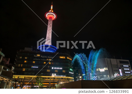 Kyoto tower and dancing fountain light up by Kyoto station at night, Japan 126833991