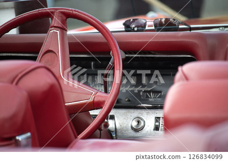 Vintage Car Interior With Red Leather and Classic Design Elements 126834099