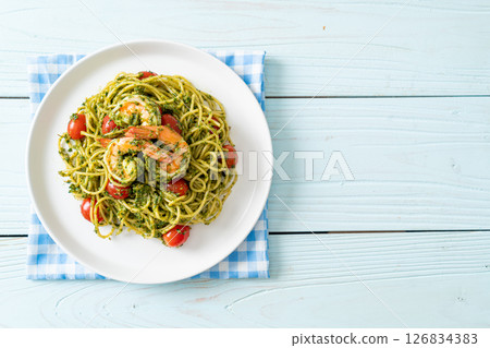 Spaghetti with prawns or shrimps in homemade pesto sauce Spaghetti with prawns or shrimps in homemade pesto sauce 126834383