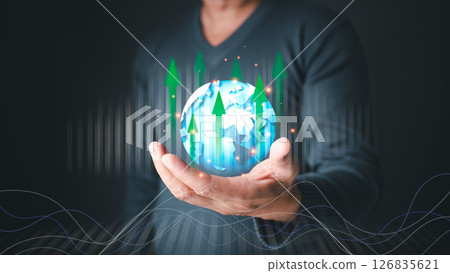 man uses a smartphone to analyze business progress, financial, and investment, tech to plan strategy for achieving goal, stock growth, and success in online business, e-commerce, and online marketing. 126835621