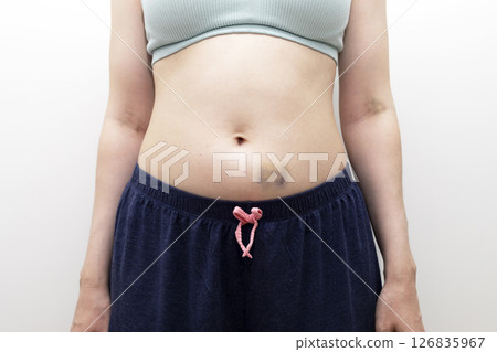 Closeup Human Abdominal Area And Hands With Hematoma, Bruise After Injection, Blood Sampling On White Background. Injury, Post-injection phlebitis. Horizontal plane. Trauma. Closeup Human Abdominal Area And Hands With Hematoma, Bruise After Injection, Blood Sampling On White Background. Injury, Post-injection phlebitis. Horizontal plane. Trauma. 126835967