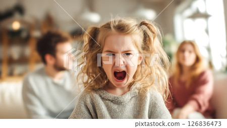 A child cries while parents argue in the background. The crying child highlights the emotional pain and turmoil caused by parental arguments. Generative AI. 126836473