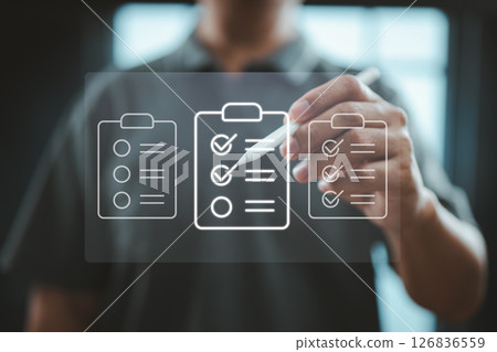 Digital Checklist Management Interface with Hand Holding Stylus for Task Tracking and Organization 126836559