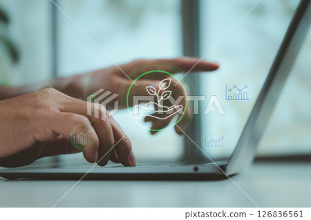Eco-Friendly Business Strategy with Sustainability Icon on Laptop 126836561