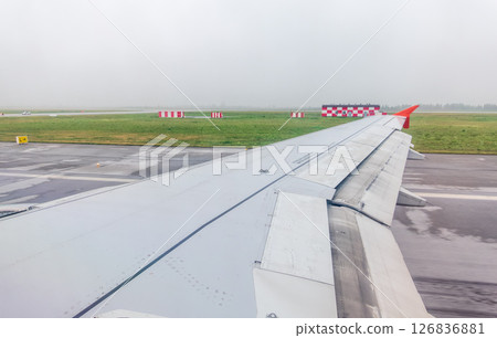 View from the airplane window during taking off on a clear summer morning. Yekaterinburg, Russia 126836881