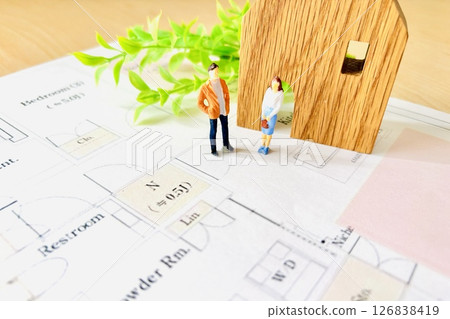 A couple thinking about the floor plan of their own home 126838419