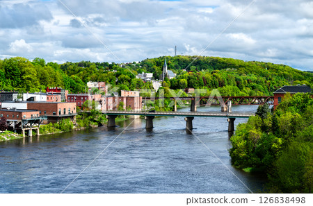 Aerial view of Calumet Bridge and Maine Central Railroad Bridge across the Kennebec River in Augusta, Maine, United States 126838498