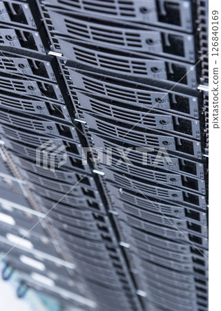 Cluster of data storage hard drives inside server room Cluster of data storage hard drives inside server room 126840169