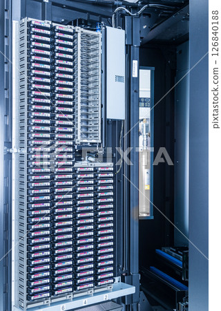 cluster of hard drives stacked inside data storage cabinet cluster of hard drives stacked inside data storage cabinet 126840188