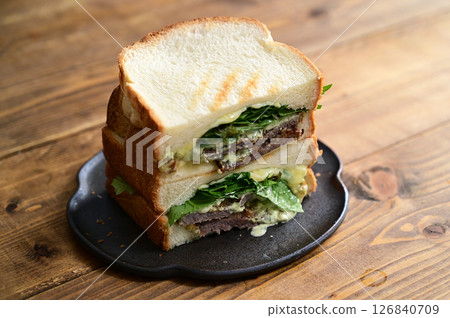 Beef cutlet and basil mayonnaise sandwich 126840709