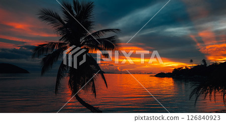 Palm Trees on White Sandy Beach with Island View in Azure Sea 126840923