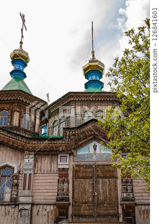 Holy Trinity Cathedral in Karakol city, Kyrgyzstan. Wooden church, architecture. Kyrgyzstan Diocese of the Russian Orthodox Church 126841601