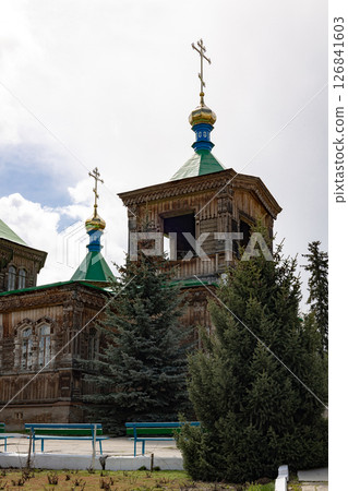 Holy Trinity Cathedral in Karakol city, Kyrgyzstan. Wooden church, architecture. Kyrgyzstan Diocese of the Russian Orthodox Church 126841603