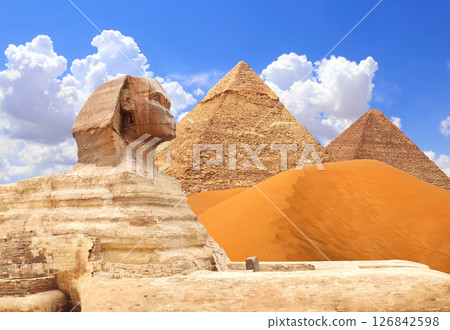 Famous Great Sphinx and pyramids of Chephren and Cheops, Cairo, Egypt. Great Pyramids and statue of Sphinx, Giza Necropolis. Topic of vacation, travel, trip abroad on vacation, cruises and tours Famous Great Sphinx and pyramids of Chephren and Cheops, Cairo, Egypt. Great Pyramids and statue of Sphinx, Giza Necropolis. Topic of vacation, travel, trip abroad on vacation, cruises and tours 126842598