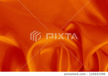 Orange fabric cloth texture for background and design art work, beautiful crumpled pattern of silk or linen. Orange fabric cloth texture for background and design art work, beautiful crumpled pattern of silk or linen. 126842996