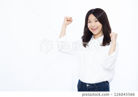 A woman doing a guts pose with a smile 126843566