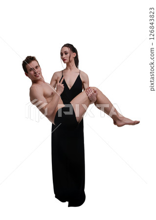 Woman in lingerie playfully poses with shirtless man in a stylish setting Woman in lingerie playfully poses with shirtless man in a stylish setting 126843823