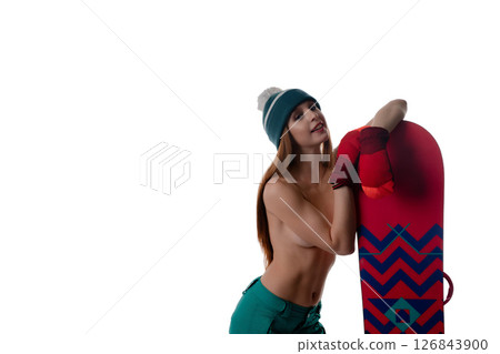 Woman modeling lingerie while holding a snowboard in a minimalistic setting 126843900