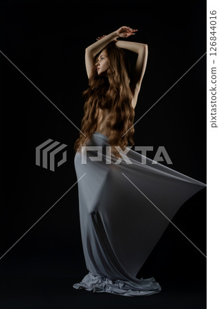 Model showcasing elegance during casting call in studio setting 126844016