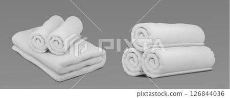 Folded white spa towel linens on gray background 126844036