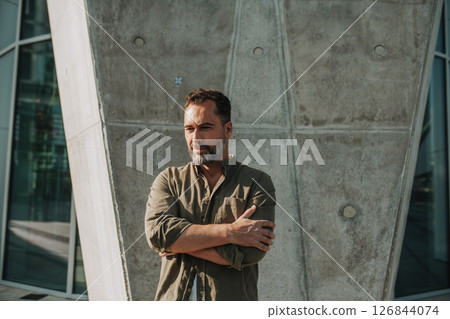 Portrait of confident middle-aged man standing outdoors. 126844074