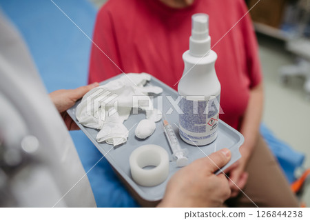 Close up of doctor carry a tray with vaccination tools Close up of doctor carry a tray with vaccination tools 126844238