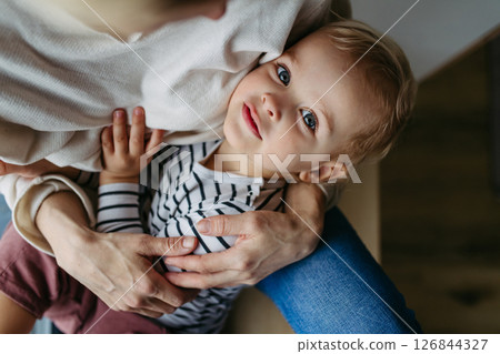 Beautiful mother hugging little son, 126844327