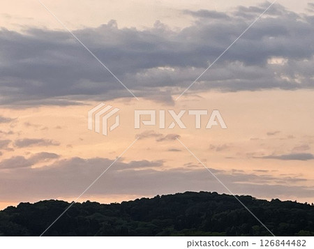 Sunset seen through the gaps in the clouds Sunset seen through the gaps in the clouds 126844482
