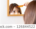 Woman who is concerned about her bangs② 126844522