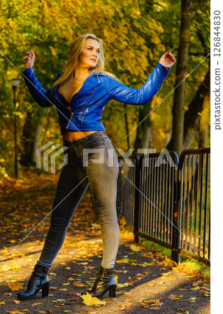 Fashion woman walking in autumn park 126844830