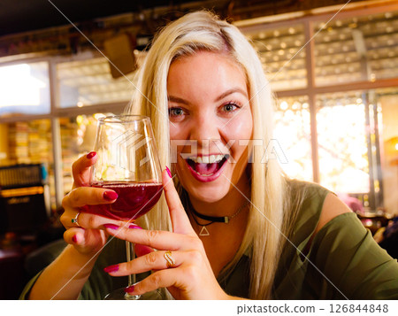 Girl with alcohol glass in pub club Girl with alcohol glass in pub club 126844848