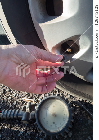 Remove the valve caps from the car tires 126845128