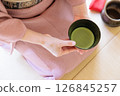 The gesture of presenting a bowl of matcha tea 126845257