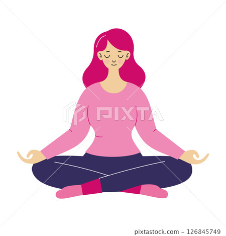 A young woman with pink hair sits cross-legged in a meditative pose. A young woman with pink hair sits cross-legged in a meditative pose. 126845749