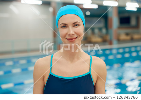 Pretty caucasian young woman in swimming cap and swimsuit 126845760