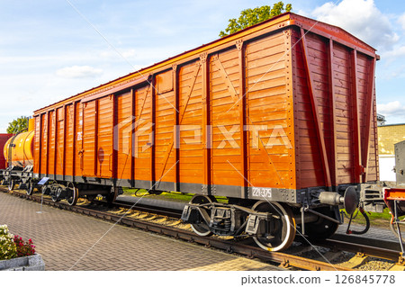 Red orange vintage retro train steam locomotive wooden wagon Belarus. Red orange vintage retro train steam locomotive wooden wagon Belarus. 126845778