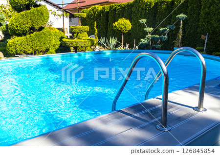 Metal stair railing by the pool garden in Brest Belarus. 126845854