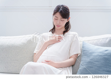 Young pregnant woman with morning sickness in late pregnancy Young pregnant woman with morning sickness in late pregnancy 126846327