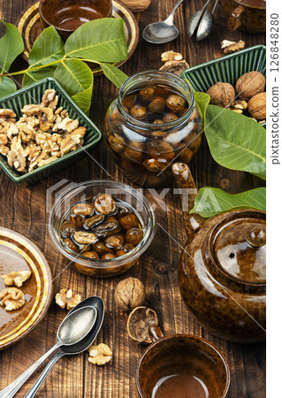 Young Green walnut jam. Young Green walnut jam. 126848280