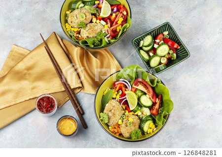 Buddha bowl with vegetables and fish cutlets. Buddha bowl with vegetables and fish cutlets. 126848281