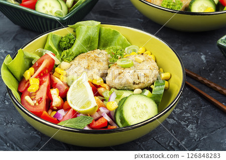 Buddha bowl with fish cakes, healthy food. Buddha bowl with fish cakes, healthy food. 126848283