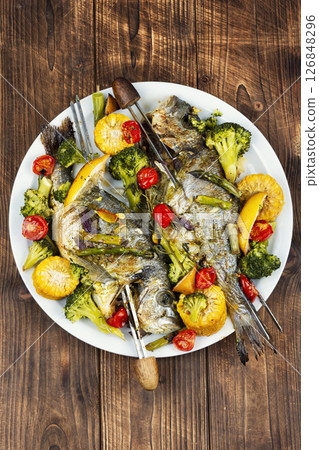 Two ready-made grilled fish. 126848296