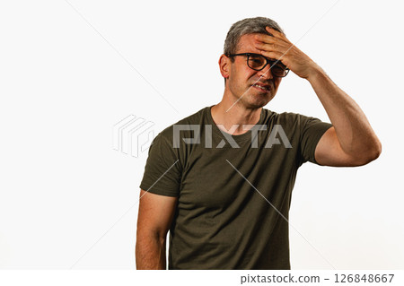 Man showing signs of fatigue while standing indoors Man showing signs of fatigue while standing indoors 126848667