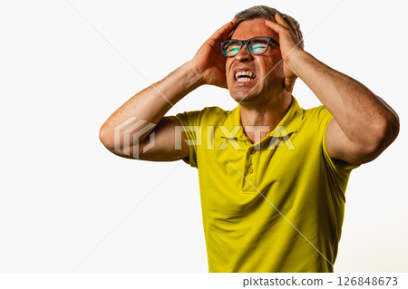 Man expresses frustration and stress while indoors Man expresses frustration and stress while indoors 126848673