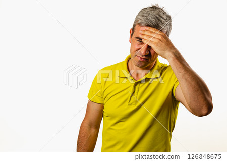 Man showing frustration in a simple studio setting Man showing frustration in a simple studio setting 126848675