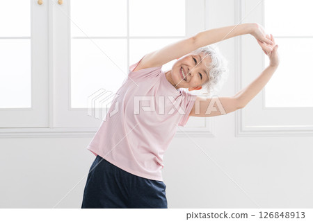 Senior woman stretching, sports image Senior woman stretching, sports image 126848913