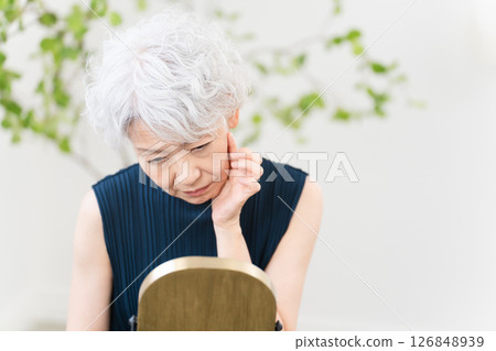 Senior woman doing skin care Beauty image Senior woman doing skin care Beauty image 126848939