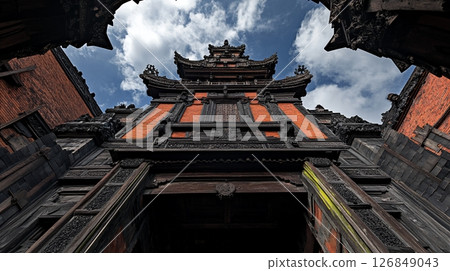 Intricate Balinese Temple Architecture Detailed Wooden Gateway Ancient Orange Brickwork Traditional 126849043